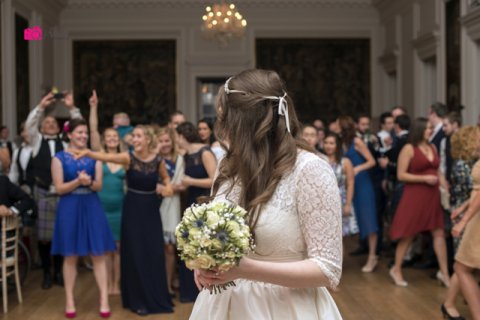 throwing the bridal bouquet - The Stockbridge Flower Company