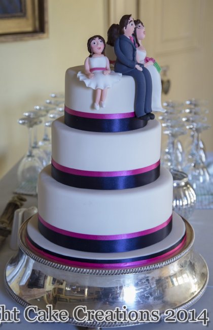 Simple wedding cake with ribbon to match the wedding accessories and topped with sugar models - Midnight Cake Creations