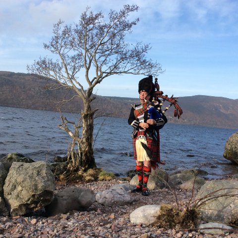 Poignant moment at Loch Ness - Piper on Parade