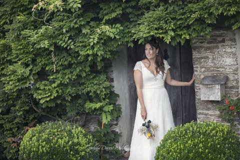 Beautiful Bride contemplating at the cottage door at the Cornish Tipi's, Cornwall - Graham Davies Wedding Photography