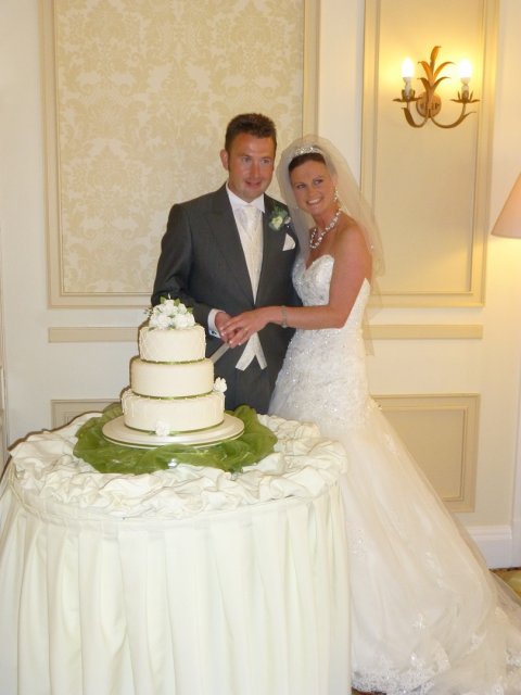 A beautiful bride with her groom cutting the wedding cake - Downe Arms Country Inn