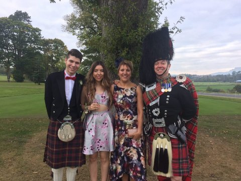 With Wedding guests - Piper on Parade